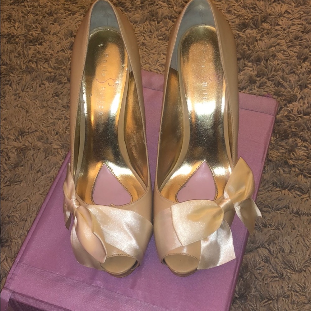 Leather peep toe with satin bow.